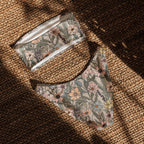 Vintage wildflower print recycled bandeau bikini top and bottoms with soft floral design on neutral background