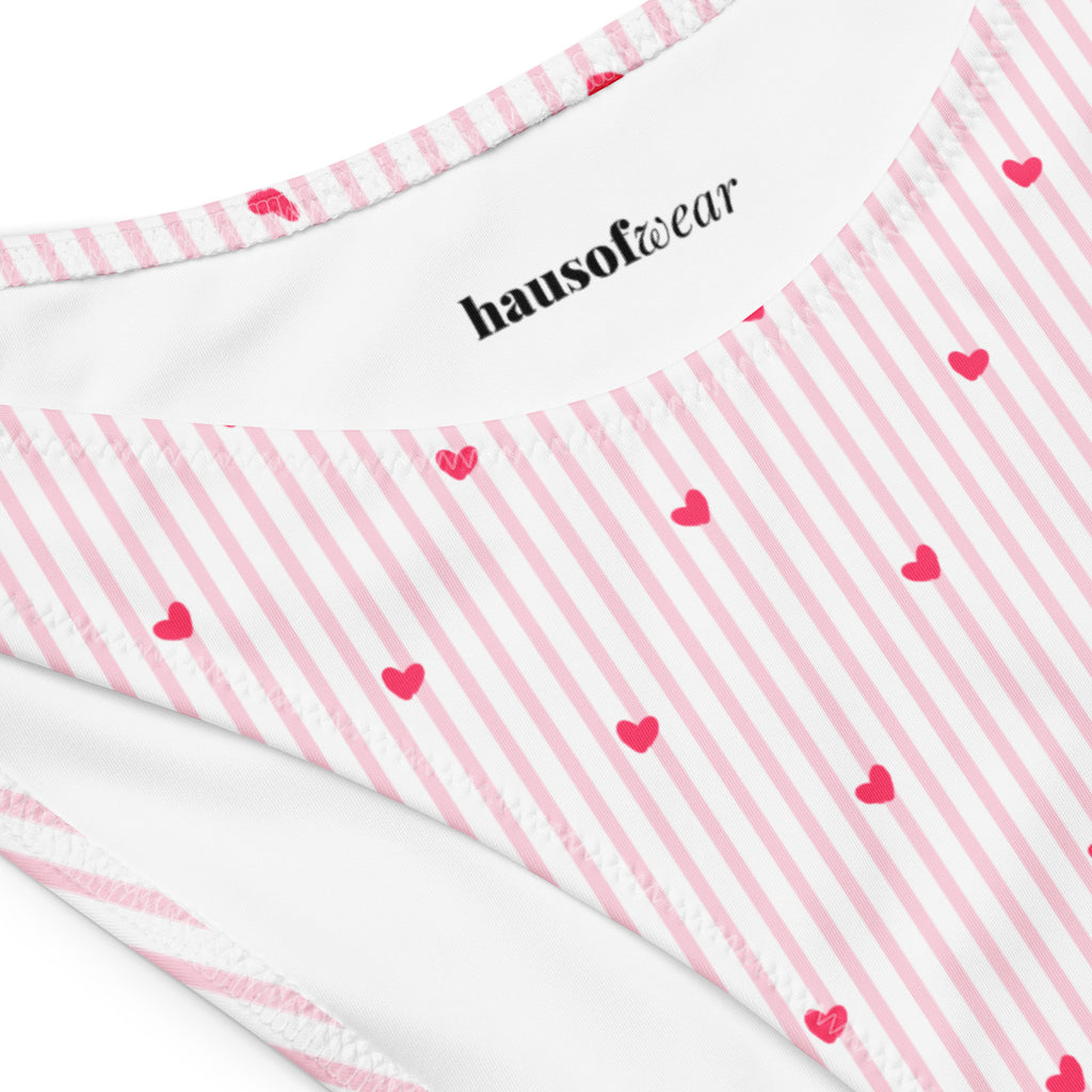 Striped heart print recycled bandeau bikini top and high-leg bottoms on a neutral background