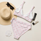Striped heart print high-waisted bikini set with removable padding displayed on a light surface