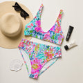 Abstract preppy print high-waisted bikini set with removable padding on a light background