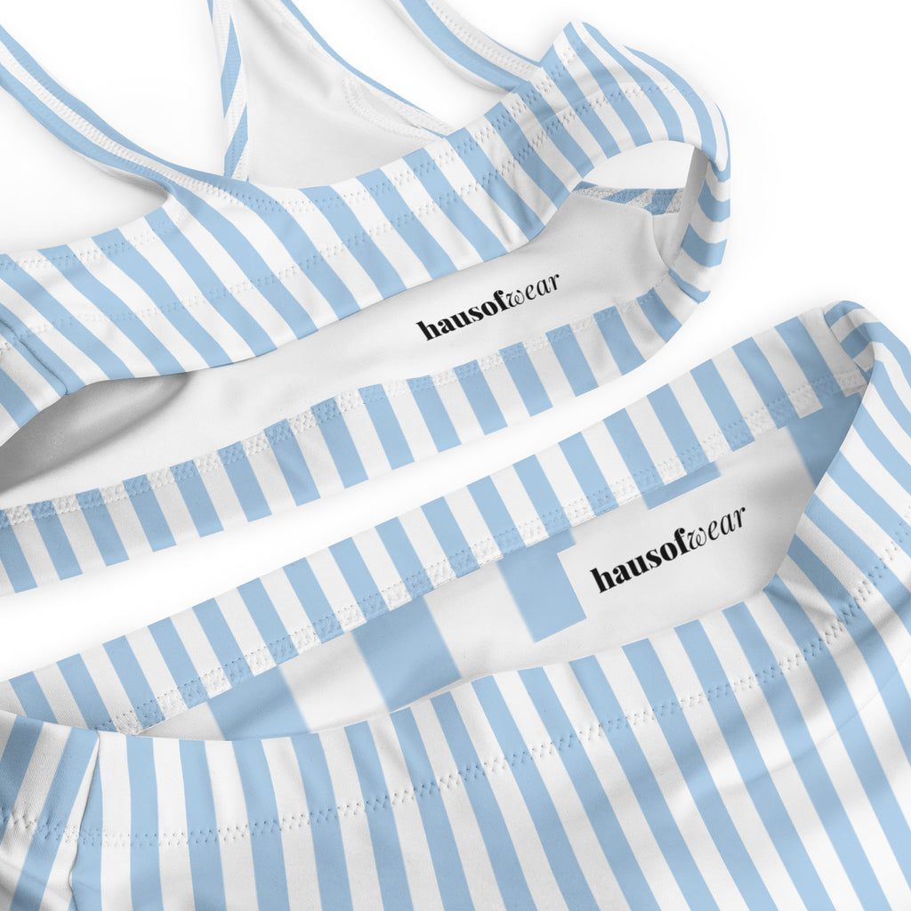 Blue and white striped recycled high-waisted bikini set with removable padding on a light background