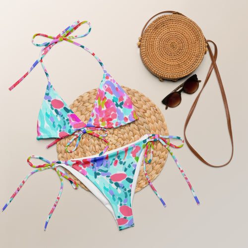 Abstract preppy all-over print recycled string bikini with tie straps on a white background