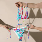 Abstract preppy all-over print recycled string bikini with tie straps on a white background
