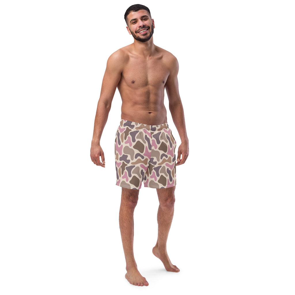 Pink old school camouflage pattern recycled men's swim trunks on a white product background