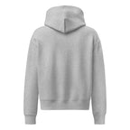 Women's relaxed fit hoodie displayed in a cozy flat lay on a neutral background