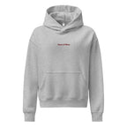Women's relaxed fit hoodie displayed in a cozy flat lay on a neutral background