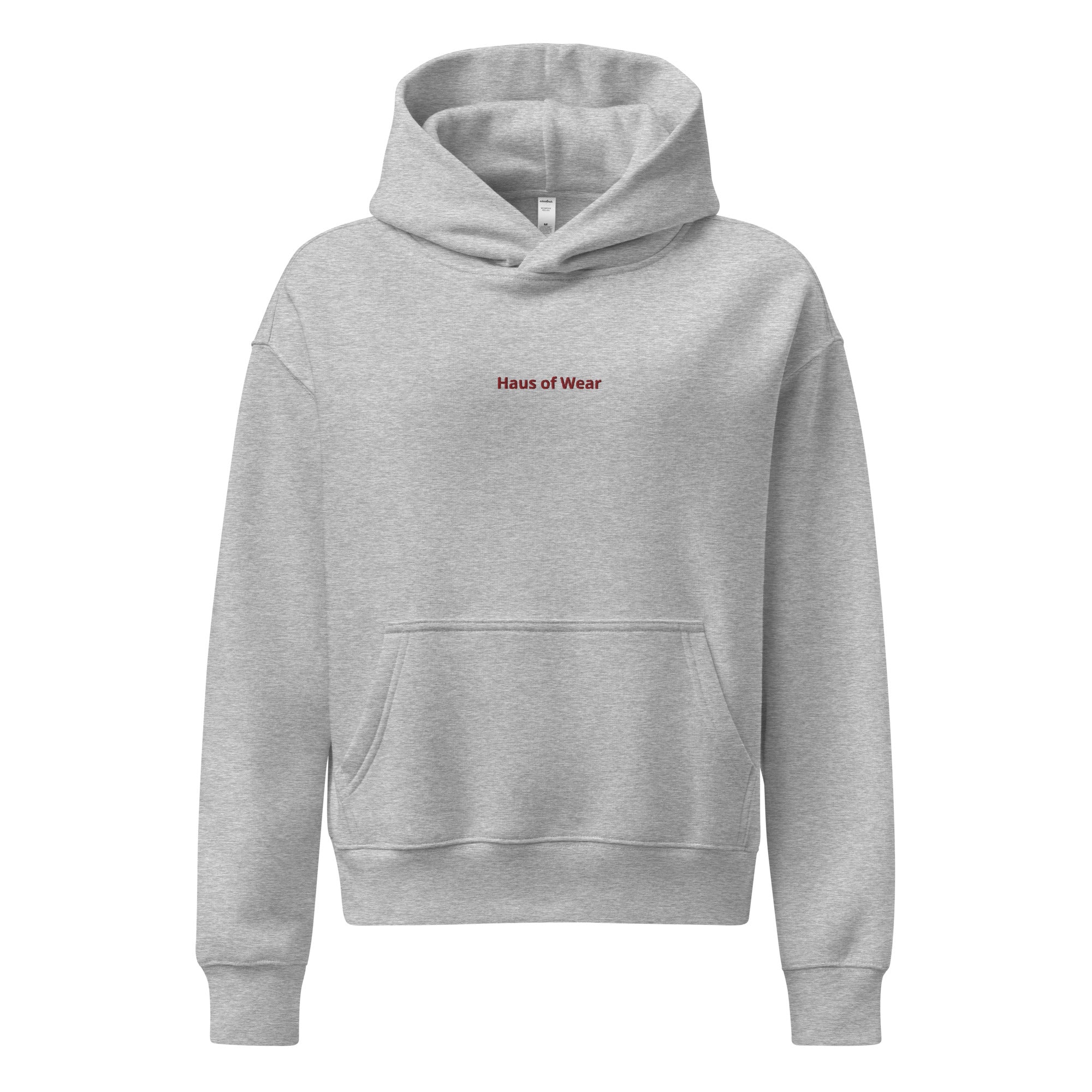 Women's relaxed fit hoodie displayed in a cozy flat lay on a neutral background
