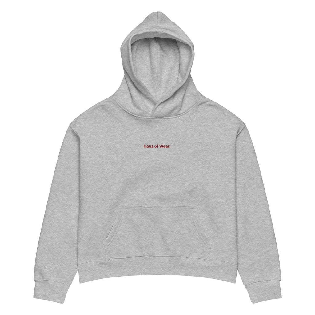 Women's relaxed fit hoodie displayed in a cozy flat lay on a neutral background
