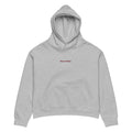 Women's relaxed fit hoodie displayed in a cozy flat lay on a neutral background