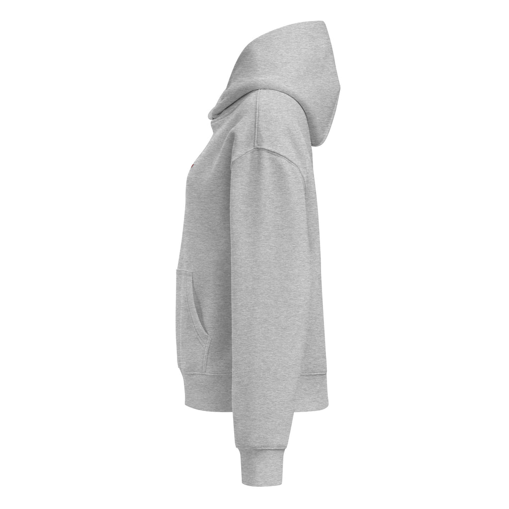 Women's relaxed fit hoodie displayed in a cozy flat lay on a neutral background