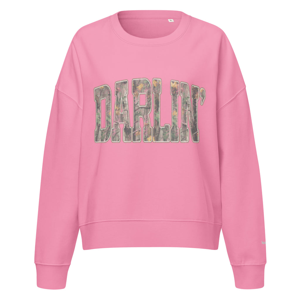 Darlin' script graphic women's organic crew neck sweatshirt in a cozy flat lay setup