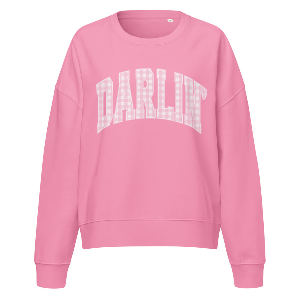 Pink Darlin' women's organic crew neck sweatshirt with southern script graphic on a flat lay