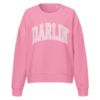 Pink Darlin' women's organic crew neck sweatshirt with southern script graphic on a flat lay