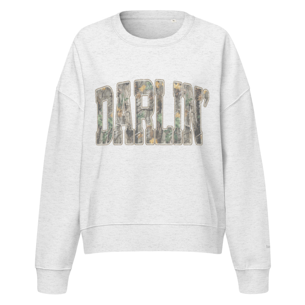 Darlin' script graphic women's organic crew neck sweatshirt in a cozy flat lay setup