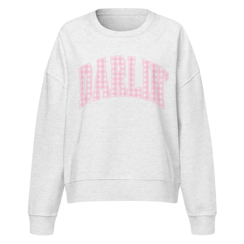 Pink Darlin' women's organic crew neck sweatshirt with southern script graphic on a flat lay