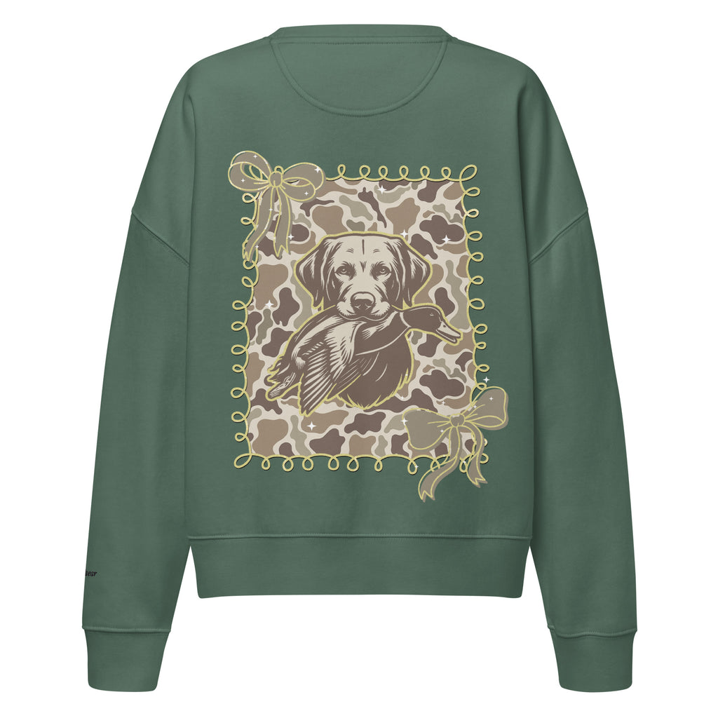 Camo hunting dog graphic women's organic crew neck sweatshirt displayed on a flat surface