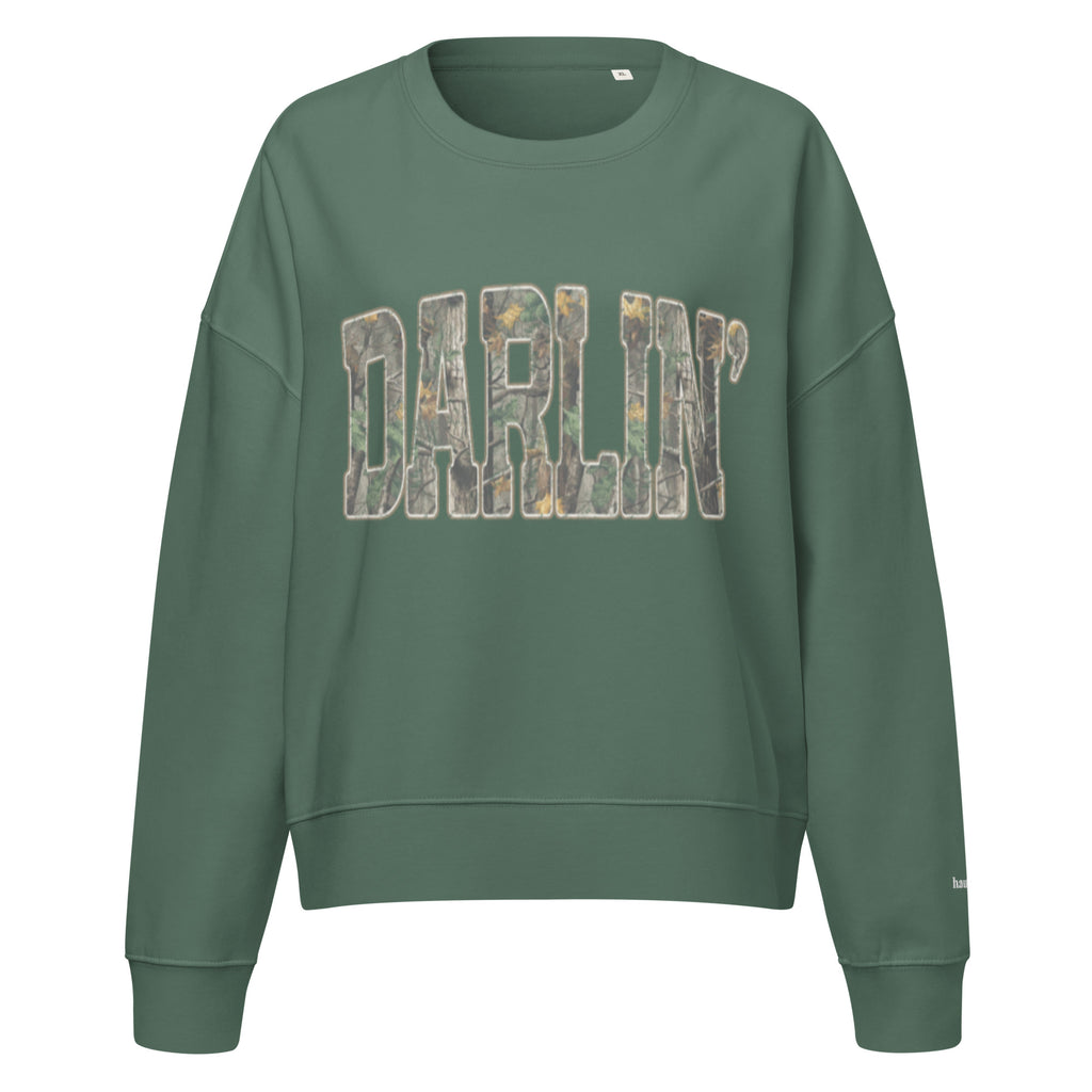 Darlin' script graphic women's organic crew neck sweatshirt in a cozy flat lay setup