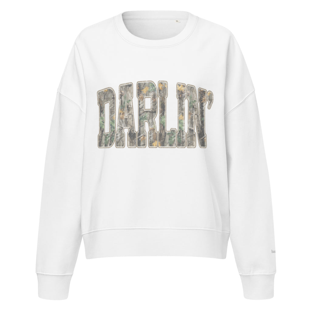 Darlin' script graphic women's organic crew neck sweatshirt in a cozy flat lay setup